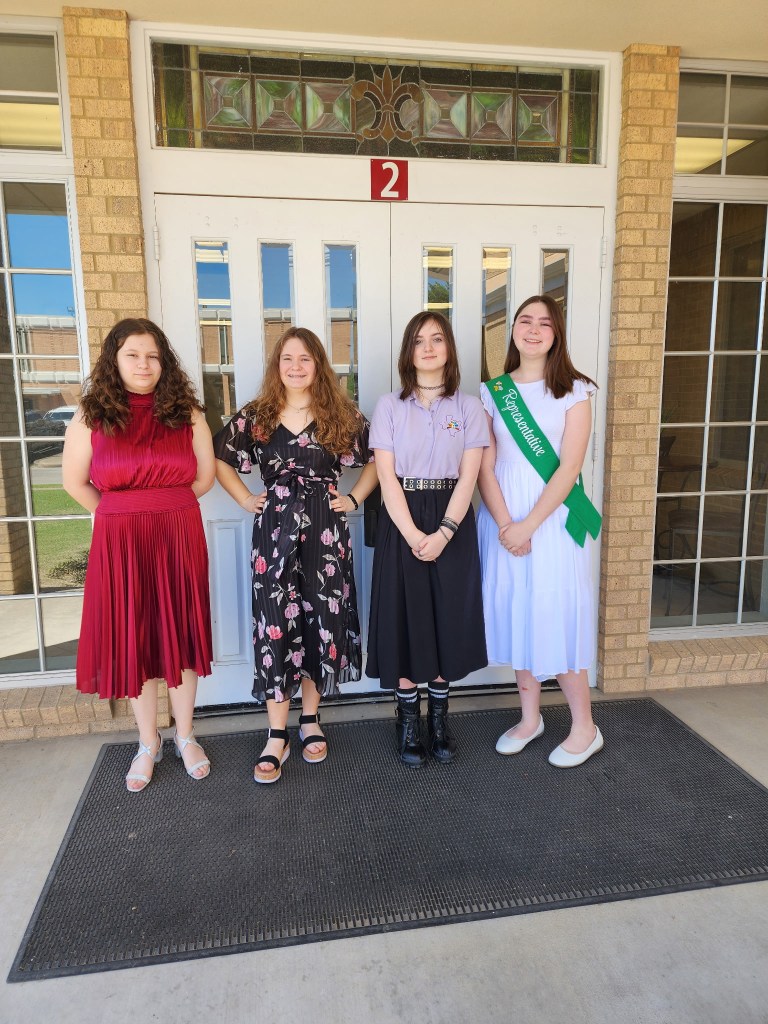 Girls are attending church together.
